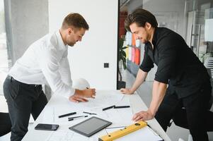 Engineers are helping to design work on blueprints and collaborate on structural analyzing of project types. photo