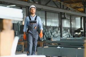 Factory worker. Man working on the production line. photo