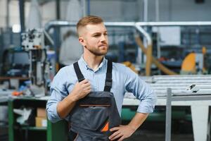 Factory worker. Man working on the production line. photo