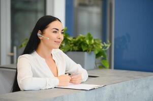 Picture of pretty receptionist at work. photo