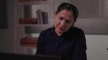 Woman reads emails on laptop at night, feels depressed after receiving bad news online Failed to pass professional exam Receive notification of termination Unemployment concept video