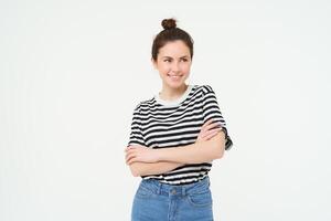 Image of young confident woman in casual outfit, looking happy, standing against white background photo