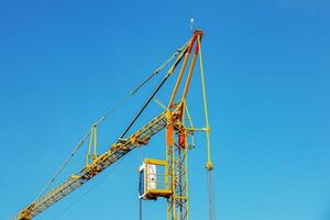 Construction crane at the construction site of an apartment building. photo