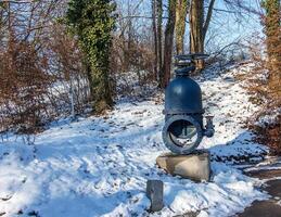 An ancient valve for water and steam. A technical monument on the slope of Mount Festung in the area of the Hohensalzburg fortress. photo