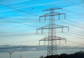 High voltage power lines along a road in Austria. photo