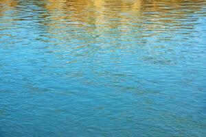 Background of the water surface of the Salzach river. Texture of water of a mountain river. photo