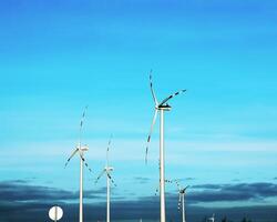 Wind farm park next to a road in Austria in sunny weather. photo