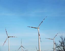 Wind farm park next to a road in Austria in sunny weather. photo