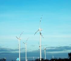 Wind farm park next to a road in Austria in sunny weather. photo