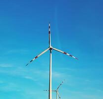 Wind farm park next to a road in Austria in sunny weather. photo