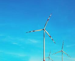 Wind farm park next to a road in Austria in sunny weather. photo