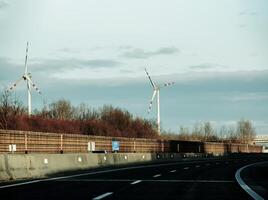 Wind farm park next to a road in Austria in sunny weather. photo