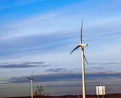 Wind farm park next to a road in Austria in sunny weather. photo