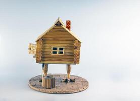 un figurilla de un de madera casa en pollo piernas. baba yaga casa. hecho a mano. foto