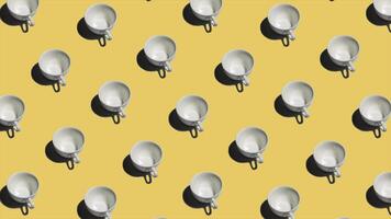 Pattern with many empty tea cups animated on yellow background. Mugs move in different directions. 4K video