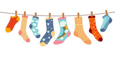 Socks on rope. Cotton or wool sock dry and hang on laundry string with clothespins. Children socks with textures and patterns vector cartoon