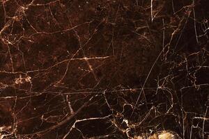 white pattern in dark brown marble texture background for product design photo