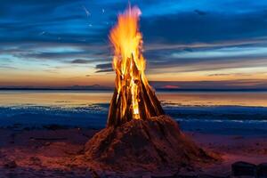 The big fire burns against the background of the night sky, close up photo