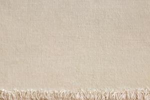 marrón algodón tela textura fondo, sin costura modelo de natural textil. foto