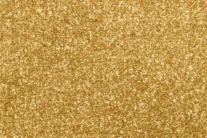 Abstract blur gold glitter sparkle defocused bokeh light background photo