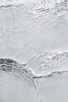 Texture of water on light background photo