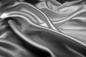 Black silk texture luxurious satin for abstract background. Dark tone of fabric photo