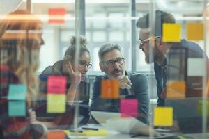 AI generated business people looking at sticky notes on glass wall photo