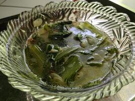 Vegetable Soup in clear bowl. Traditional hot veggie soup and delicious. photo