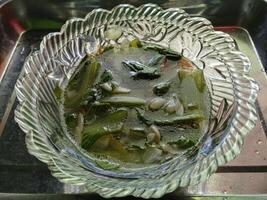 Vegetable Soup in clear bowl. Traditional hot veggie soup and delicious. photo