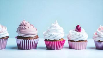 Delicious cupcakes with cream on table on light background. photo