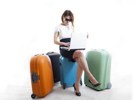 business woman with her suitcases ready to go photo