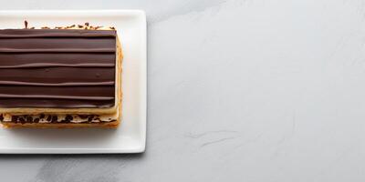 AI generated Top view of Chocolate Opera cake on white background with copy space layered delight Delicious fresh baked vegan homemade dessert photo