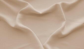 Heart-shaped pleats on peach down fabric. photo