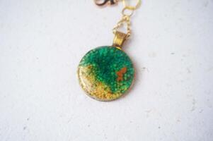 Colorful key chain made of resin and clay on a white background. Colorful key chain photo
