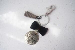 old vintage pocket watch and key on a white background photo