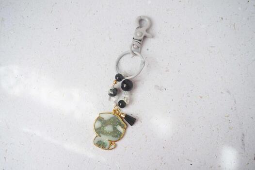 key chain on a white background in the form of a pendant photo