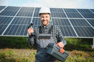 Worker installing solar panels outdoors photo