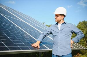 Solar power plant. Engineer on a background of photovoltaic panels. Science solar energy. photo