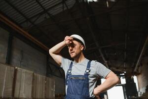 Male warehouse worker portrait in warehouse storage. photo