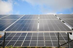 Solar Panels Against The Deep Blue Sky photo