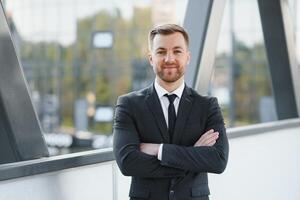 Portrait of an handsome businessman in an urban setting photo