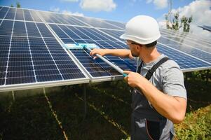 A man working at solar power station. photo