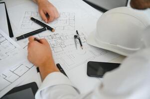 Engineers are helping to design work on blueprints and collaborate on structural analyzing of project types. photo