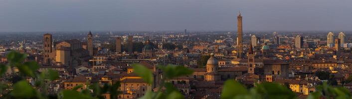 Panoramic image of the enchanting allure of Bologna's medieval charm as the sun sets, casting a warm glow over the historic cityscape photo