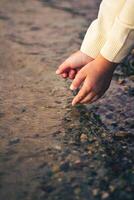 Children's hands in the water photo