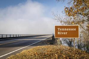 Tennessee River road sign at Natchez Trace Parkway - John Coffee Memorial Bridge, crossing from Tennessee to Alabama in fall scenery photo