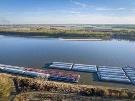 barges on the Mississippi River at a confluence with the Ohio below Cairo, Illinois, late fal aerial view photo