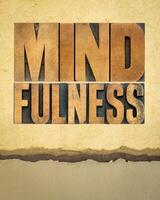 mindfulness word abstract  -  awareness concept - text in letterpress wood type on art paper, vertical poster photo