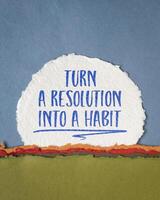 turn a resolution into a habit inspirational advice or reminder on art paper abstract, New Year resolutions, setting goals and personal development concept photo