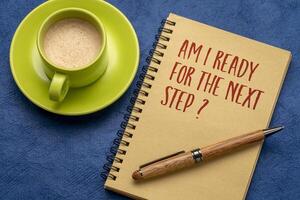 Am I ready for the next step. Self reflection question in a notebook. Personal development or career concept. photo